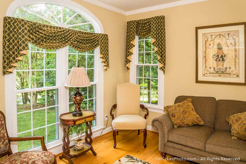 Formal living room with oval transom window