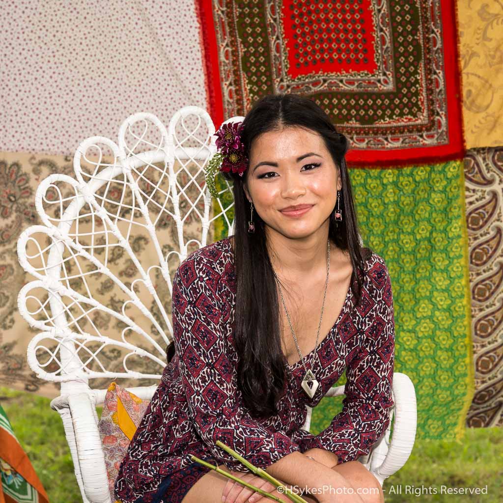 Portrait of a senior in a wicker chair as photographed by Howard Sykes of HSykes Photo