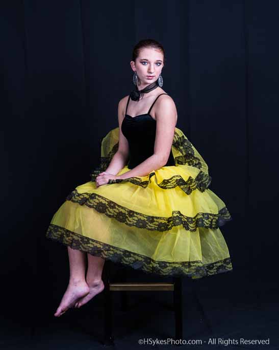 Portrait of a senior in a formal dress photographed by Howard Sykes