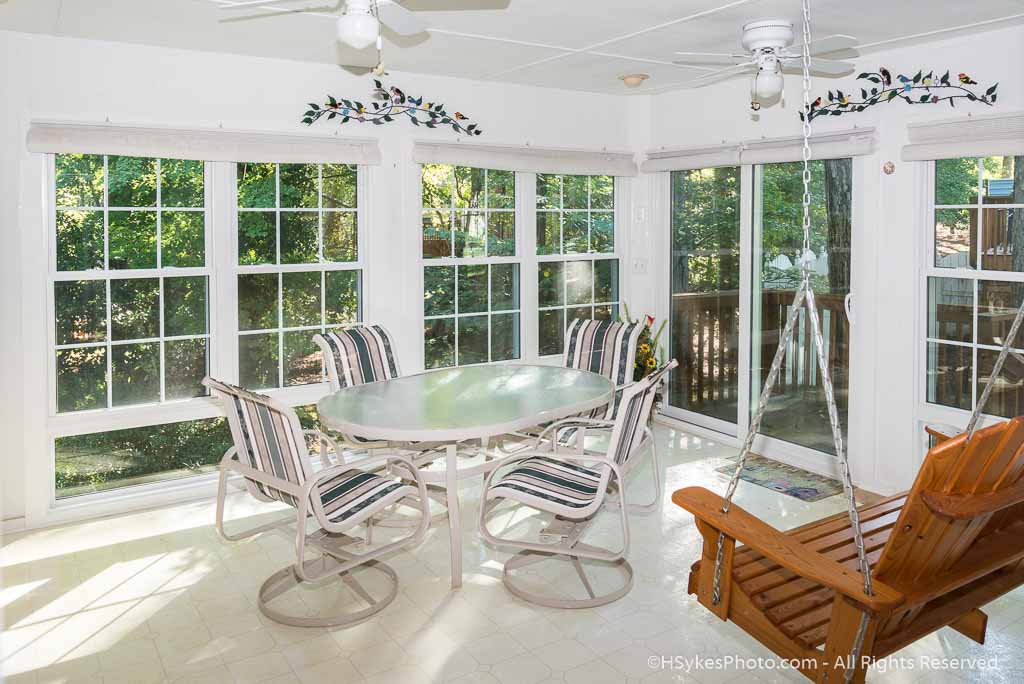 Enclosed sunroom with divided light windows