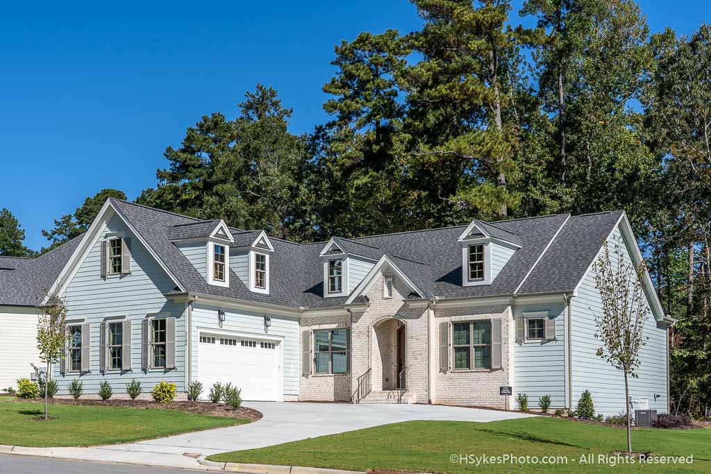 Two story home with HardiePlank and brick