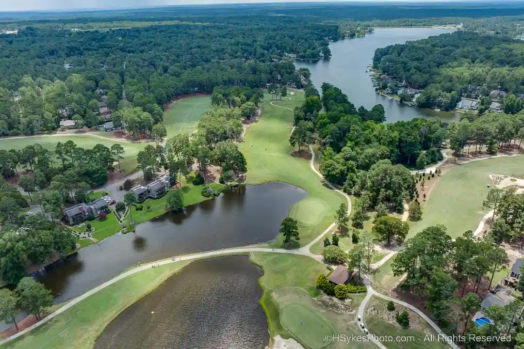 Neighbooring golf course and lake with boat ramp