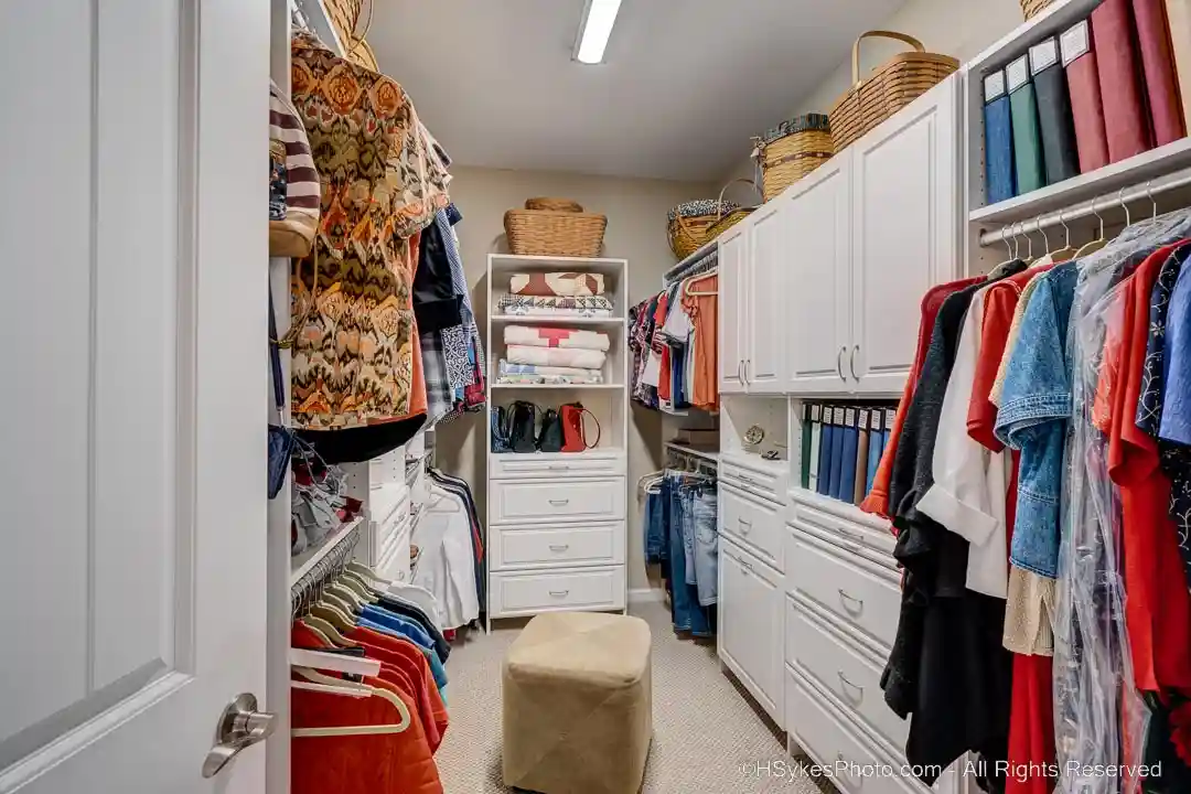 Primary closet viewed from primary dressing room